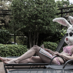 White Rabbit: American Bunny lounging on a beach chair reading fashion magazines