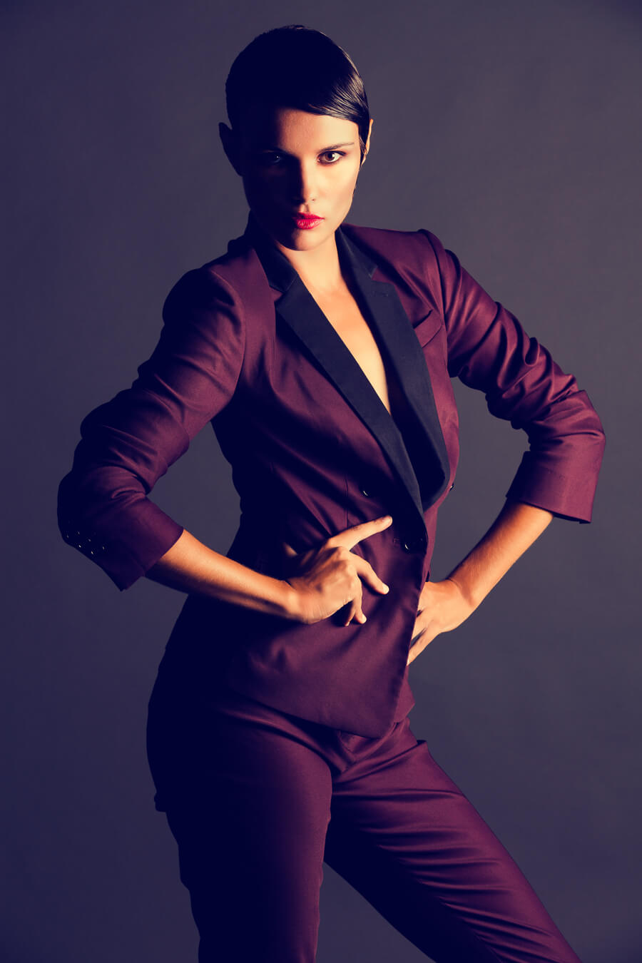 Gorgeous maroon suit with model for fashion shoot