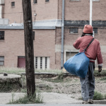 Only Temporary - Homeless in Dallas: Man walking across the street
