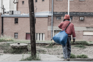 Only Temporary - Homeless in Dallas: Man walking across the street